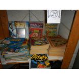 A shelf of old comics including Tiger, Terrific, Batman, Sting Ray etc.