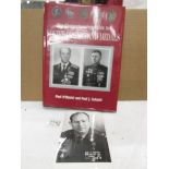 A comprehensive guide to Soviet orders and medals and a signed photograph.