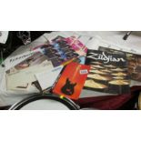 A large collection of sales brochures including Gibson, Fender, Zildjan, Ludvig etc.
