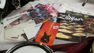 A large collection of sales brochures including Gibson, Fender, Zildjan, Ludvig etc.