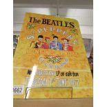 A metal Beatles poster.