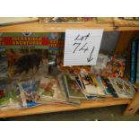 A shelf of assorted tea cards, Incredible creatures etc.