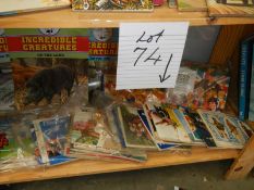 A shelf of assorted tea cards, Incredible creatures etc.