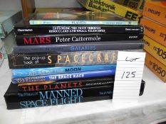 A quantity of books on the moon and outerspace