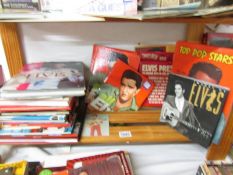 A shelf of Elvis books.