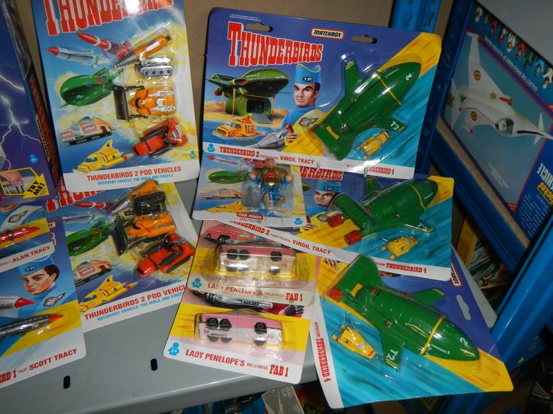 A large shelf of assorted Thunderbird toys,. - Image 2 of 3