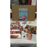 A Gerry Anderson signed photograph together with Thunderbirds books, postcards etc.