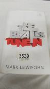 A book entitled 'The Beatles Tune In' by Mark Lewisohn.