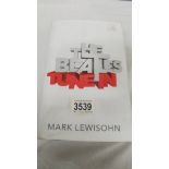 A book entitled 'The Beatles Tune In' by Mark Lewisohn.