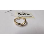 An 18ct yellow gold diamond and sapphire wishbone ring, size O, total 2.4 grams.