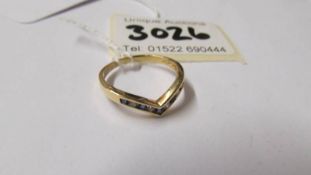 An 18ct yellow gold diamond and sapphire wishbone ring, size O, total 2.4 grams.