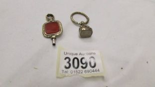 A Georgian watch key set with a hard stone together with a fob seal (fob featuring birds on an