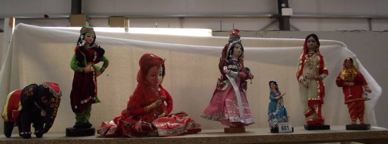 A doll of a Rajasthani woman and other dolls.