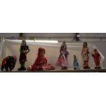 A doll of a Rajasthani woman and other dolls.