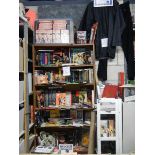 Nine shelves of Bruce Lee related items, Kung Fu books. posters, videos etc.
