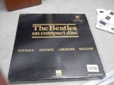 The Beatles compact disc set in black box.