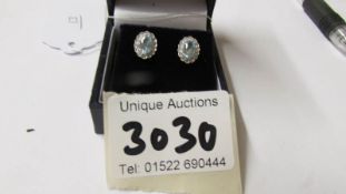 A pair of 18ct white gold aquamarine and diamond earrings of 1.5ct.