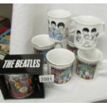 3 Beatles mugs and 4 Cavern mugs.