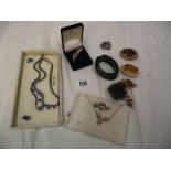 A mixed lot of vintage costume jewellery including necklaces, brooches etc.
