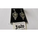 A pair of silver and marcasite art deco style earrings.
