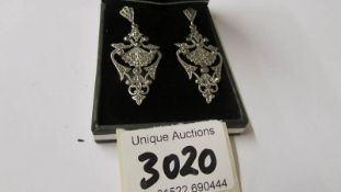 A pair of silver and marcasite art deco style earrings.