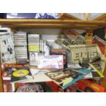 A shelf of Elvis cassettes, CD's and other memorabilia.