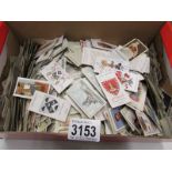 A box of approximately 2000 loose cigarette cards from a variety of manufacturers including