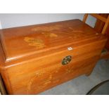 A carved camphor wood box.