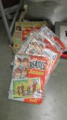 5 assorted Beatles jigsaw puzzles.