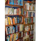 12 shelves of assorted books including some relating to India.