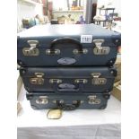 3 old cases each with oval labels reading Bon Voyage, Air India,