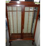 An Edwardian display cabinet (no shelves).