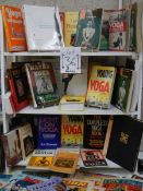 Three shelves of interesting books relating to Yoga.