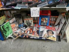 One shelf of James Bond 007 pictures, magazines, CD's etc.