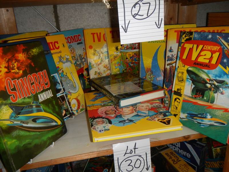 A shelf of assorted annuals including TV 21, TV Comic, Sting Ray etc.