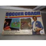 A Chad valley soccer coach coaching projector