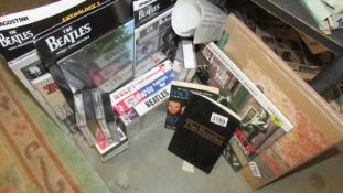 A quantity of Beatles LP's, videos, cassette tapes, books etc.