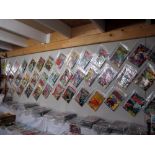 A wall of comics mainly DC from Silver Age to modern