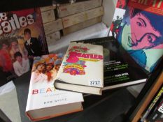 7 Beatles coffee table books.