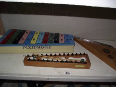 A Pixiphone glockenspiel and 1 other and a Zippy Zither