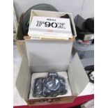 A boxed Nikon 90 camera, unused.