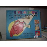 A Chad Valley 'Give a Show' projector, Popeye, Alice, Andy Pandy,complete.