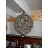 A globe shaped chandelier.