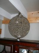 A globe shaped chandelier.