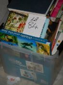 A box of assorted books including wildlife.