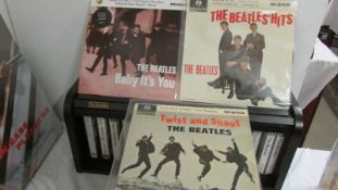 A Parlaphone 45 rpm "Beatles Hits", a Parlaphone "Twist & Shout" and "Baby Its You".