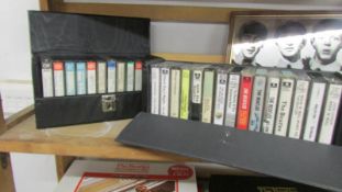 2 cases of Beatles cassette tapes.