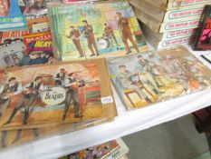 Six 1960's Beatles jigsaw puzzles illustrated by the renowned artist Walt Howarth.