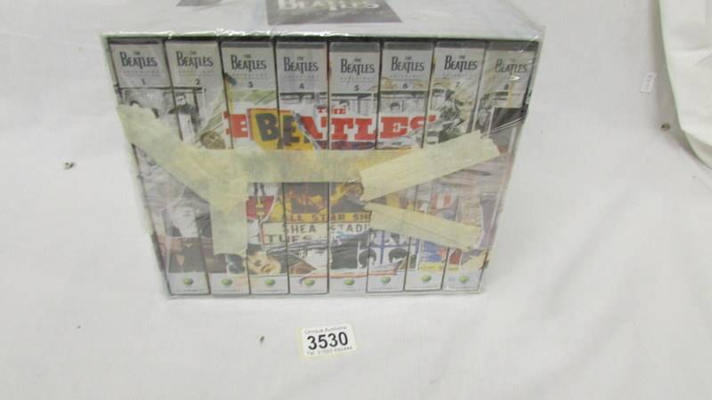 The Beatles Anthology on VHS tape.