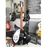 A 1999 left hand model 330 Made In USA Rickenbacker 6 string guitar with genuine hard case.